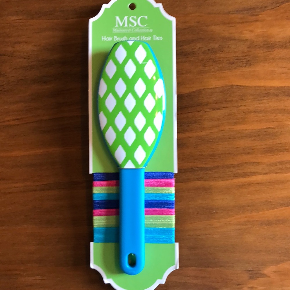 Hair brush with hair ties